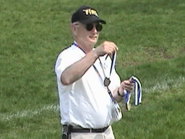 Coach Ken Reis Hands Out Awards