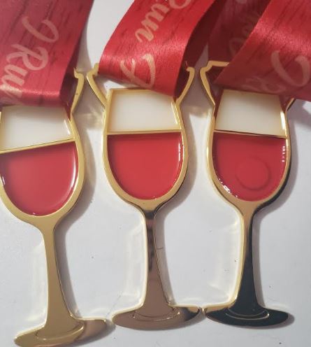 The Red Wine 5K On Easter Saturday Morning At Wings Etc. Palm Harbor FL logo